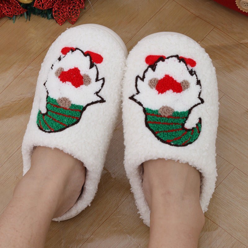 Chaussons de Noël Doudounea en peluche blanche avec motif Père Noël, design festif et douillet pour un confort optimal en intérieur